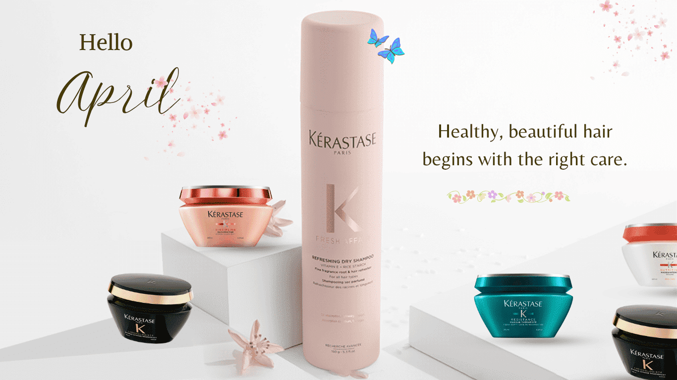 Hair care products by Kérastase set against a spring-themed backdrop.